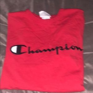 Women’s red medium champion t-shirt.
